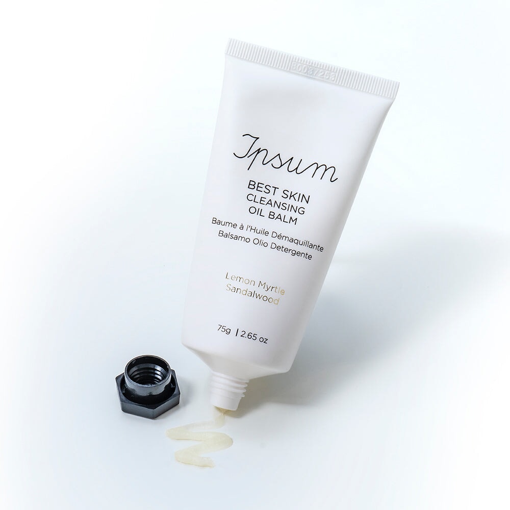Open tube of Ipsum Best Skin Cleansing Oil Balm against a white background. North Glow