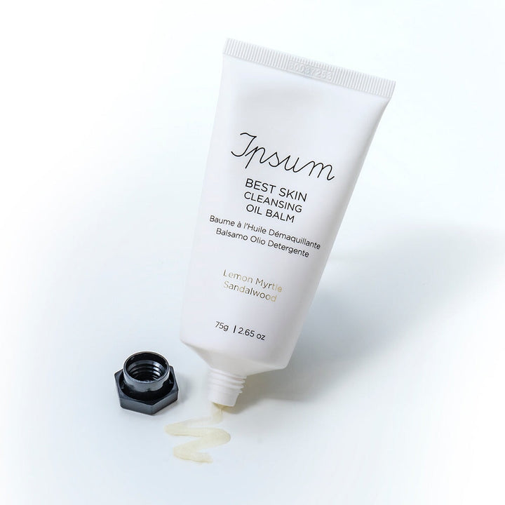 Open tube of Ipsum Best Skin Cleansing Oil Balm against a white background.