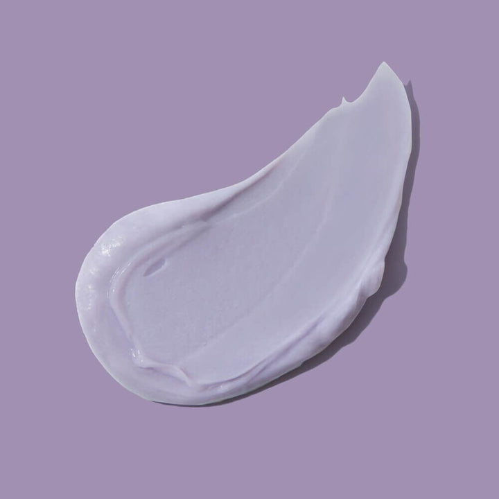 Innersense Bright Balance Conditioner Texture example against a purple background.