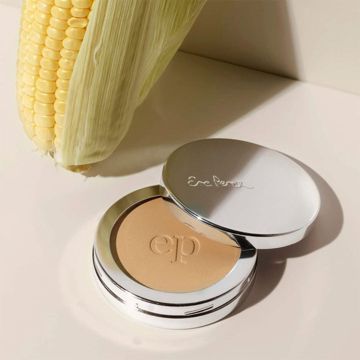 Ere Perez's open can of corn setting powder stands next to a corn cob.