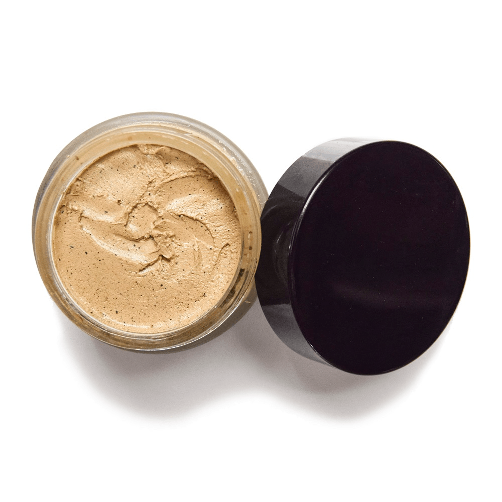 Open UMA Deeply Clarifying Face Mask screw-top jar with lid ajar from a bird's eye view. North Glow
