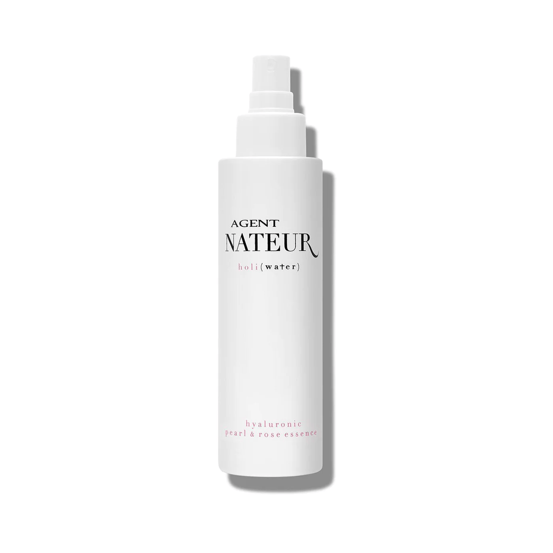Holi (Water) pearl and rose Essence white packaging against white background