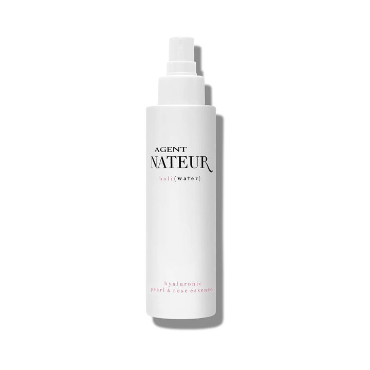 Holi (Water) pearl and rose Essence white packaging against white background