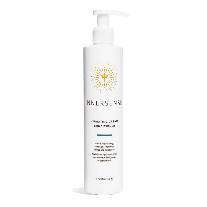 A white pump bottle of Innersense Hydrating Cream Conditioner stands against a white background.