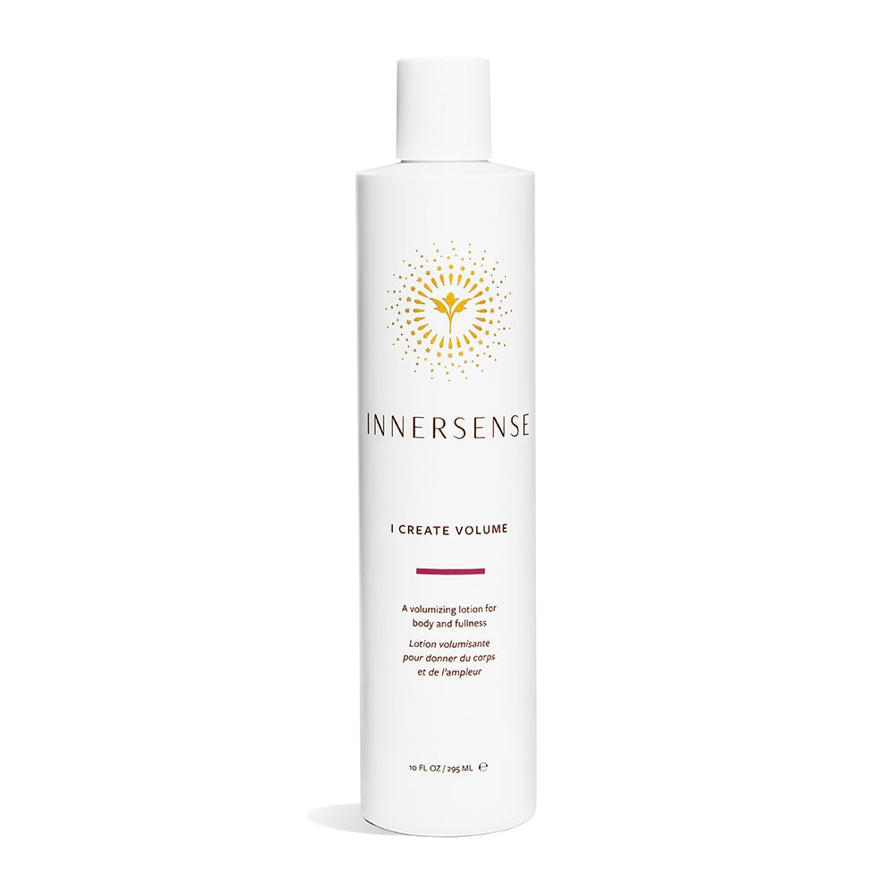 A white Innersense I Create Volume bottle stands against a white background. North Glow