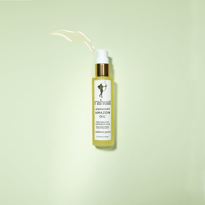 Rahua Legendary Amazon Oil bottle against a light green background.
