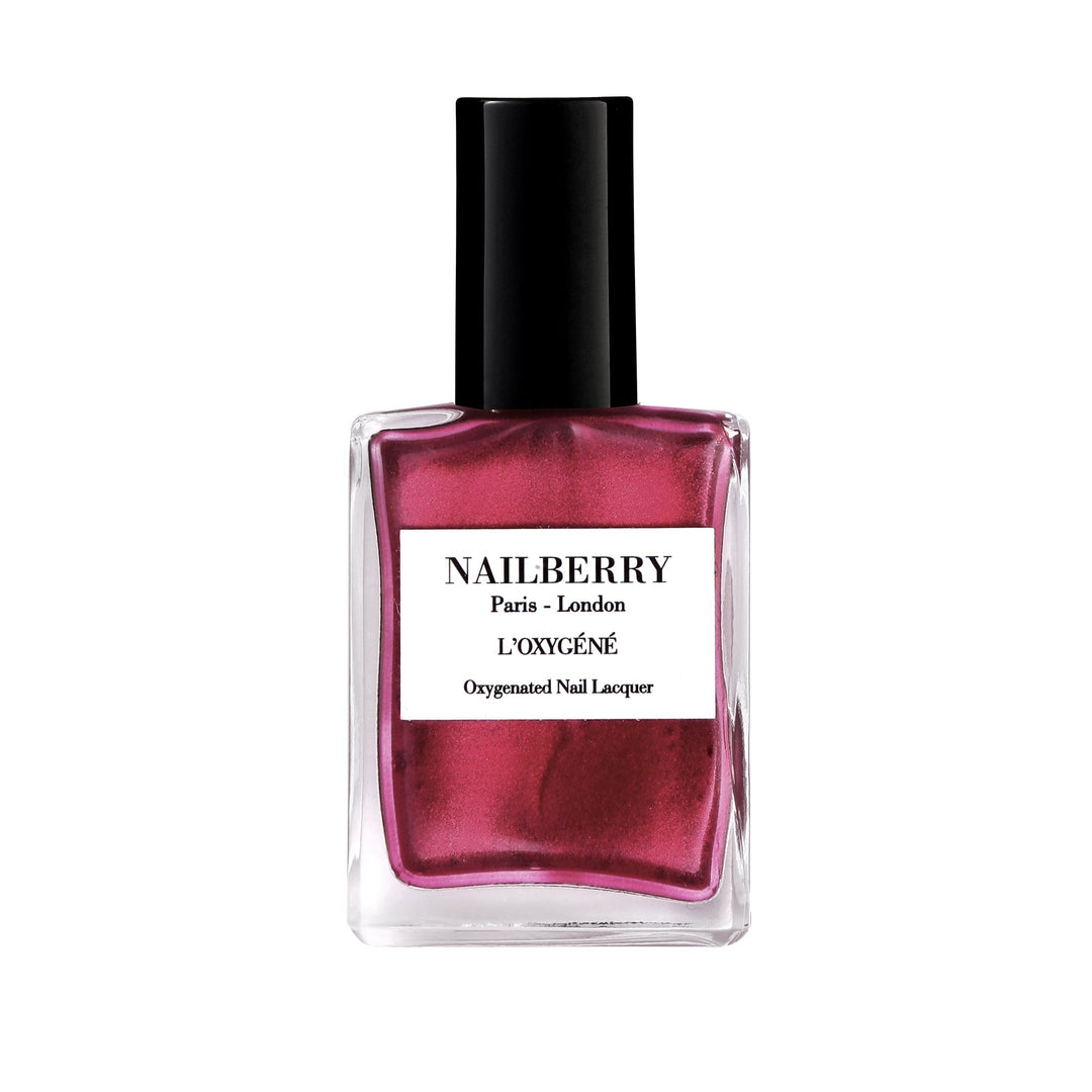 Nailberry nail polish bottle Mystique Red against white background. 