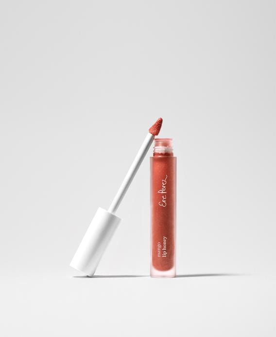 Ere Perez Mango Lip Honey Lipgloss in Chilli stands open against a white background.