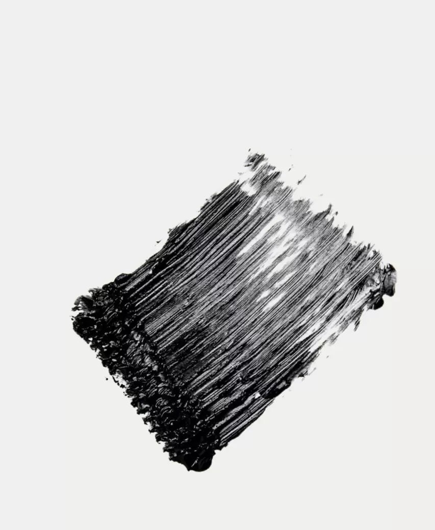 Color and texture example of Ere Perez Natural Almond Mascara in black on a white base. North Glow
