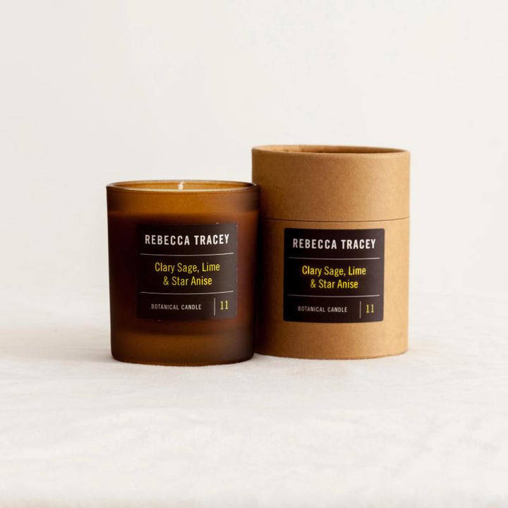 Candle jar "Clary Sage, Lime & Star Anise" and packaging next to each other against a white background.