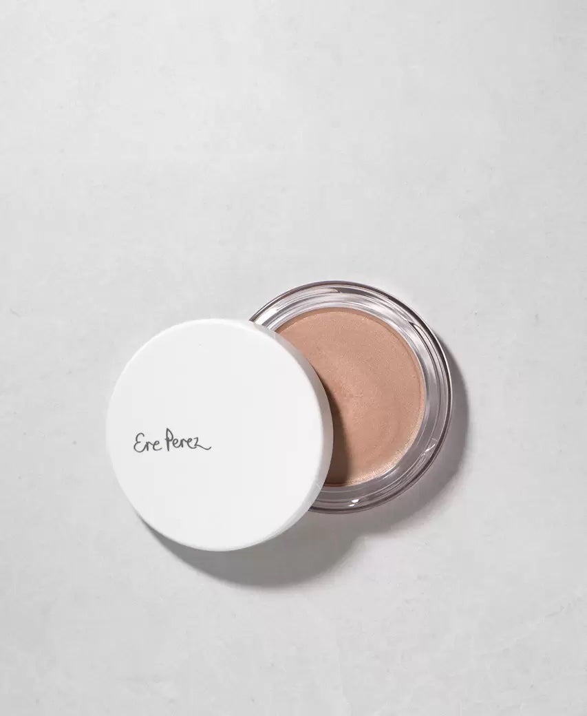 Open jar of Ere Perez Vanilla Highlighter Falling Star on a white background. North Glow