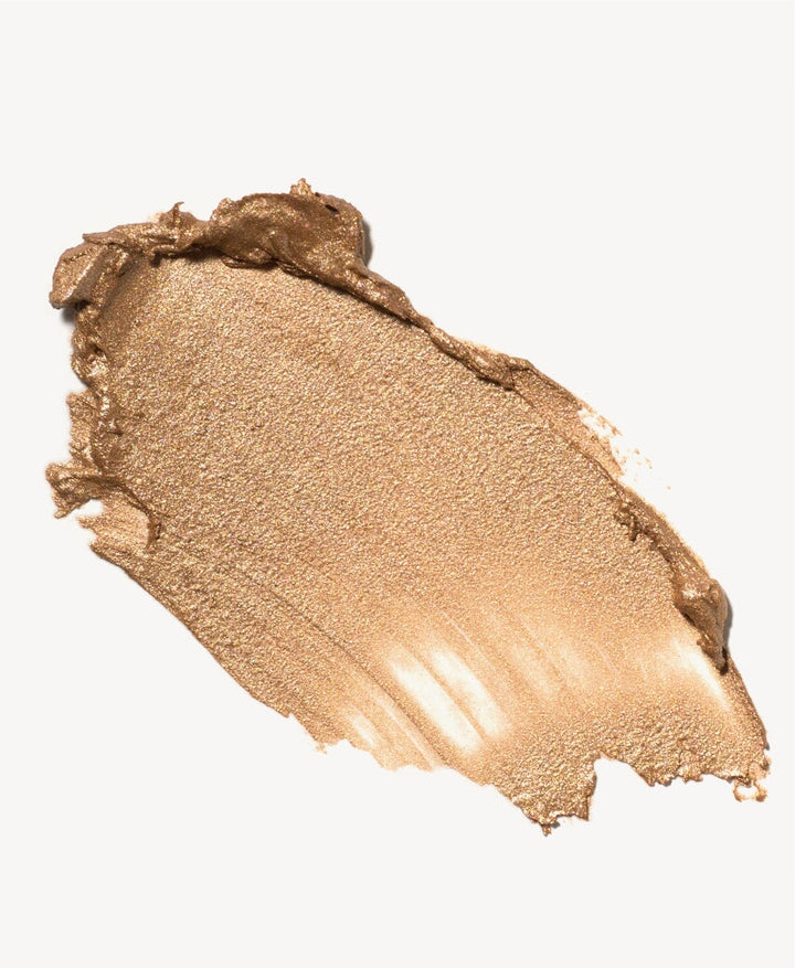 Color and texture example Ere Perez Vanilla Highlighter Sun Halo on a white base.