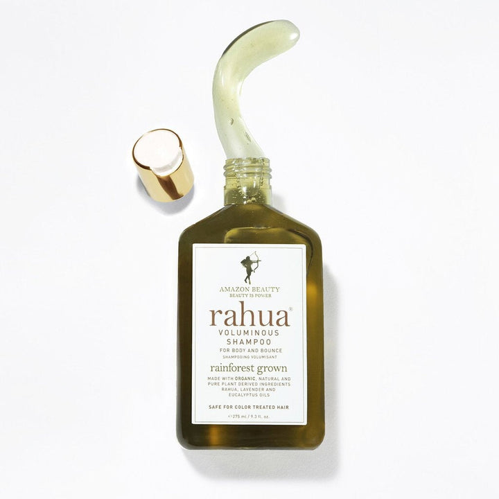 Open Rahua Voluminous Shampoo bottle with texture example against a white background.